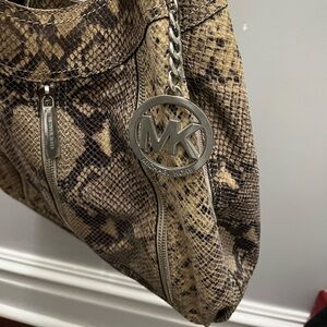 Michael Kors beautiful bag.  Found it in the back of the closet. Beautiful!